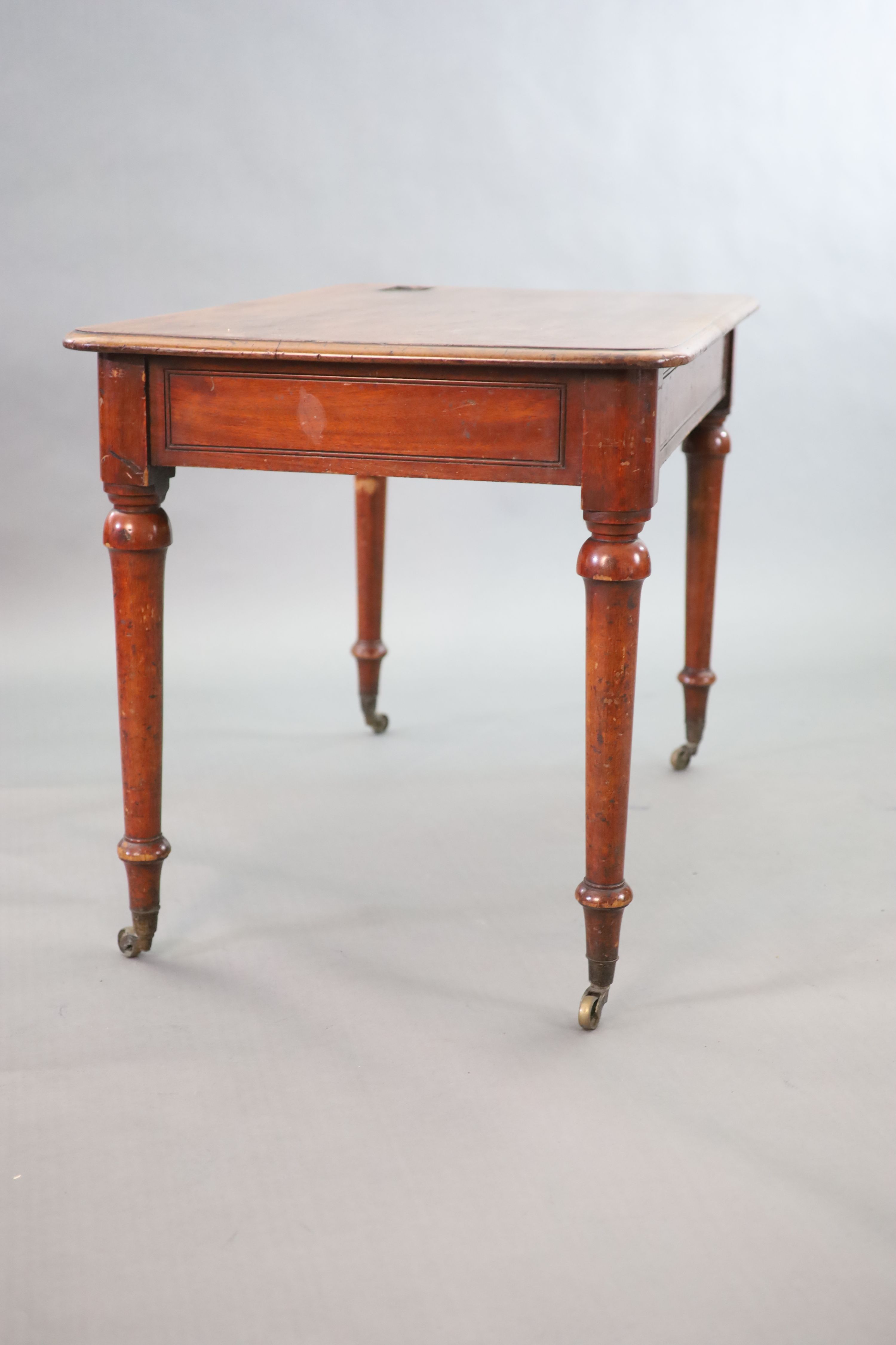 A Victorian mahogany writing table, W.114cm D.70cm H.77cm